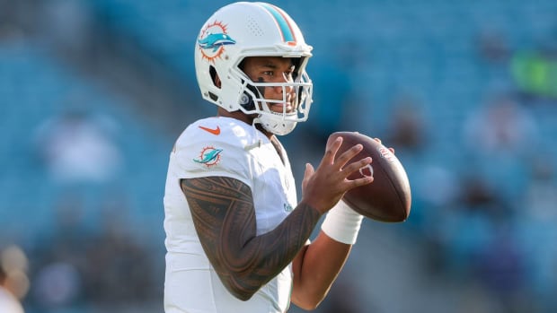 Dolphins quarterback Tua Tagovailoa throws a pass in warmups before a game.